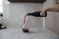 Red wine being poured into the Riedel Cabernet wine decanter