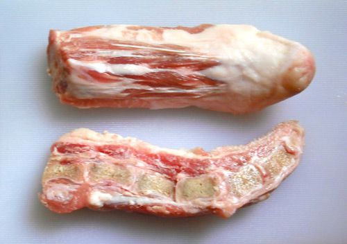 A raw pig's tail sliced in half to reveal its cross-section. 