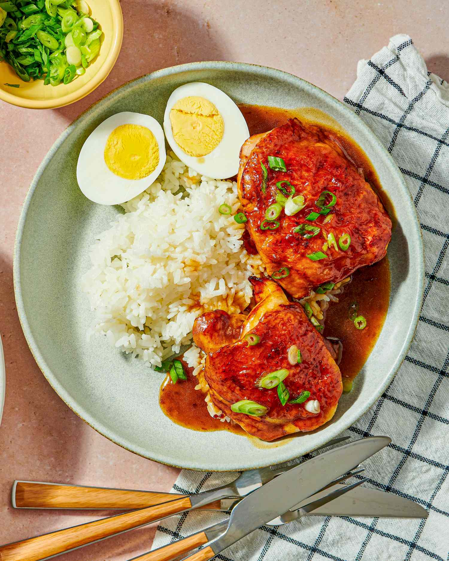 Soy and sesame roast chicken served with rice and boiled egg halves