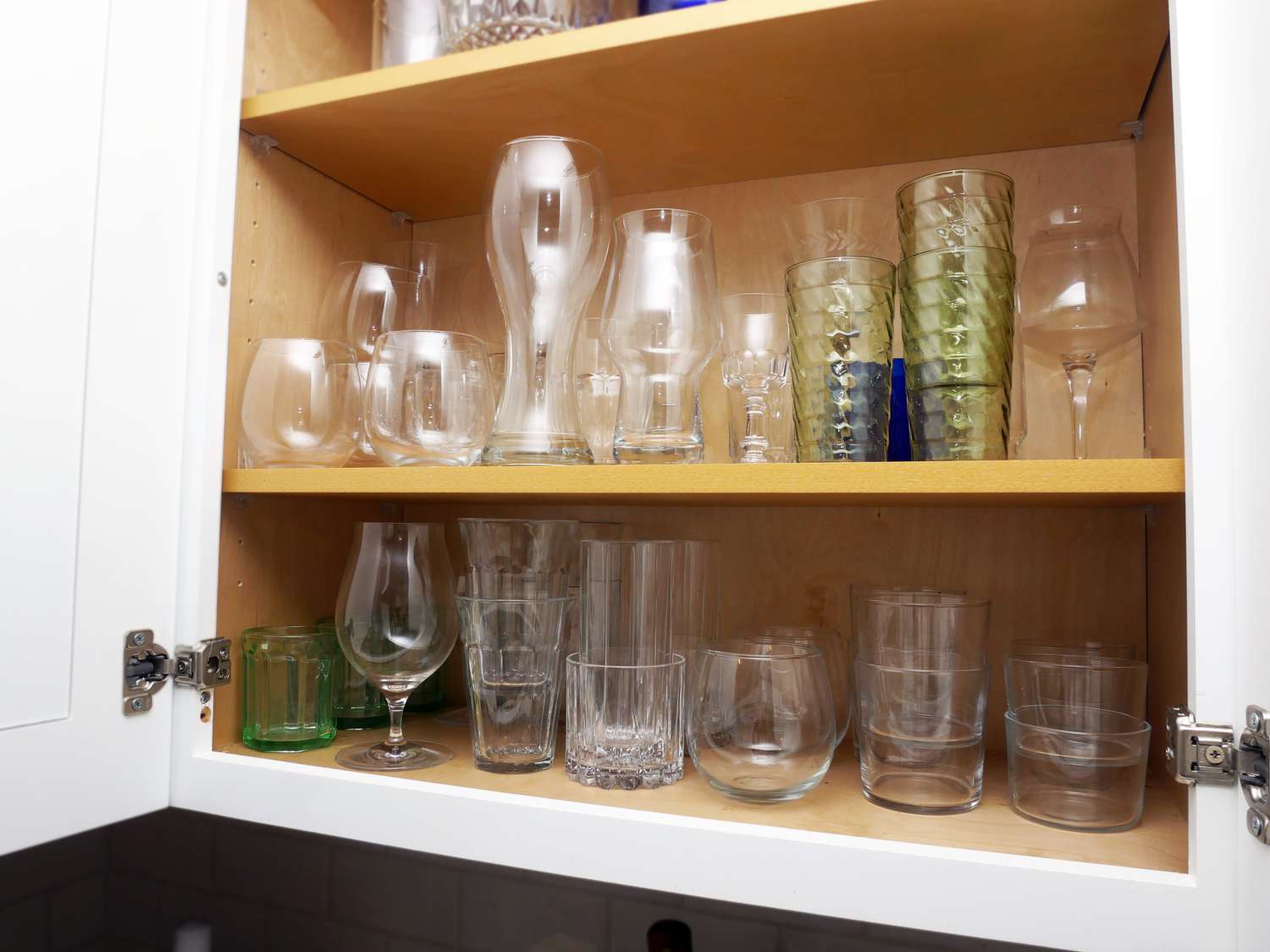 interior view of cabinet with a variety of glassware