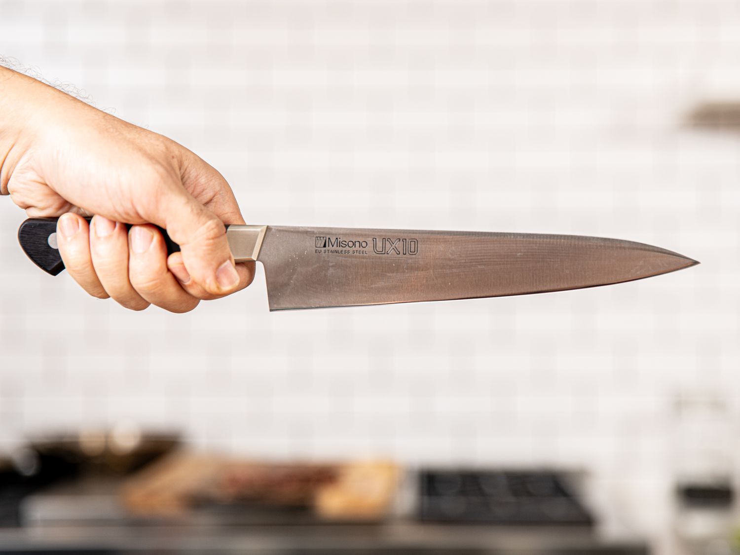 Holding a knife by the handles