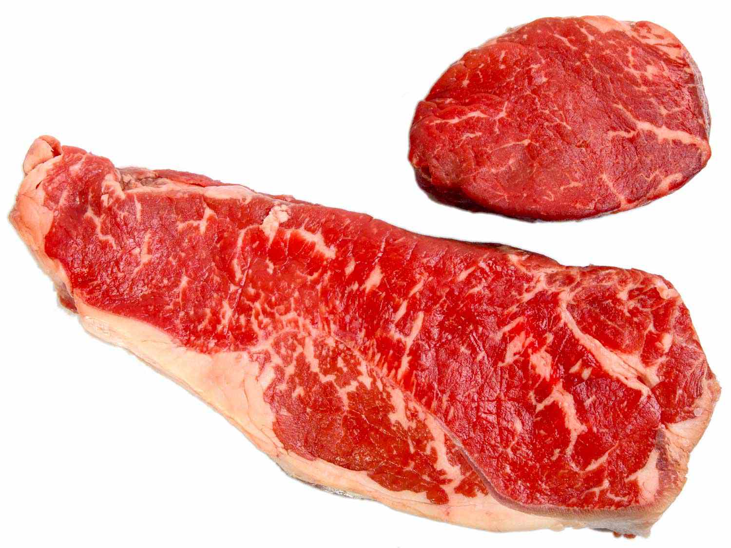 Uncooked strip steak and tenderloin