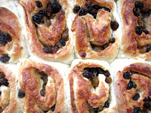 A pan of Chelsea buns studded with currants.