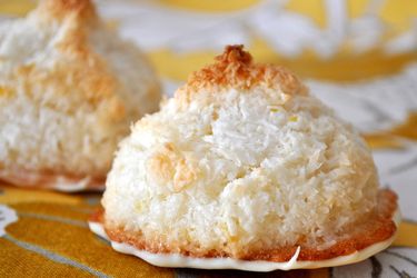 Closeup of white chocolate dipped lemon macaroons.