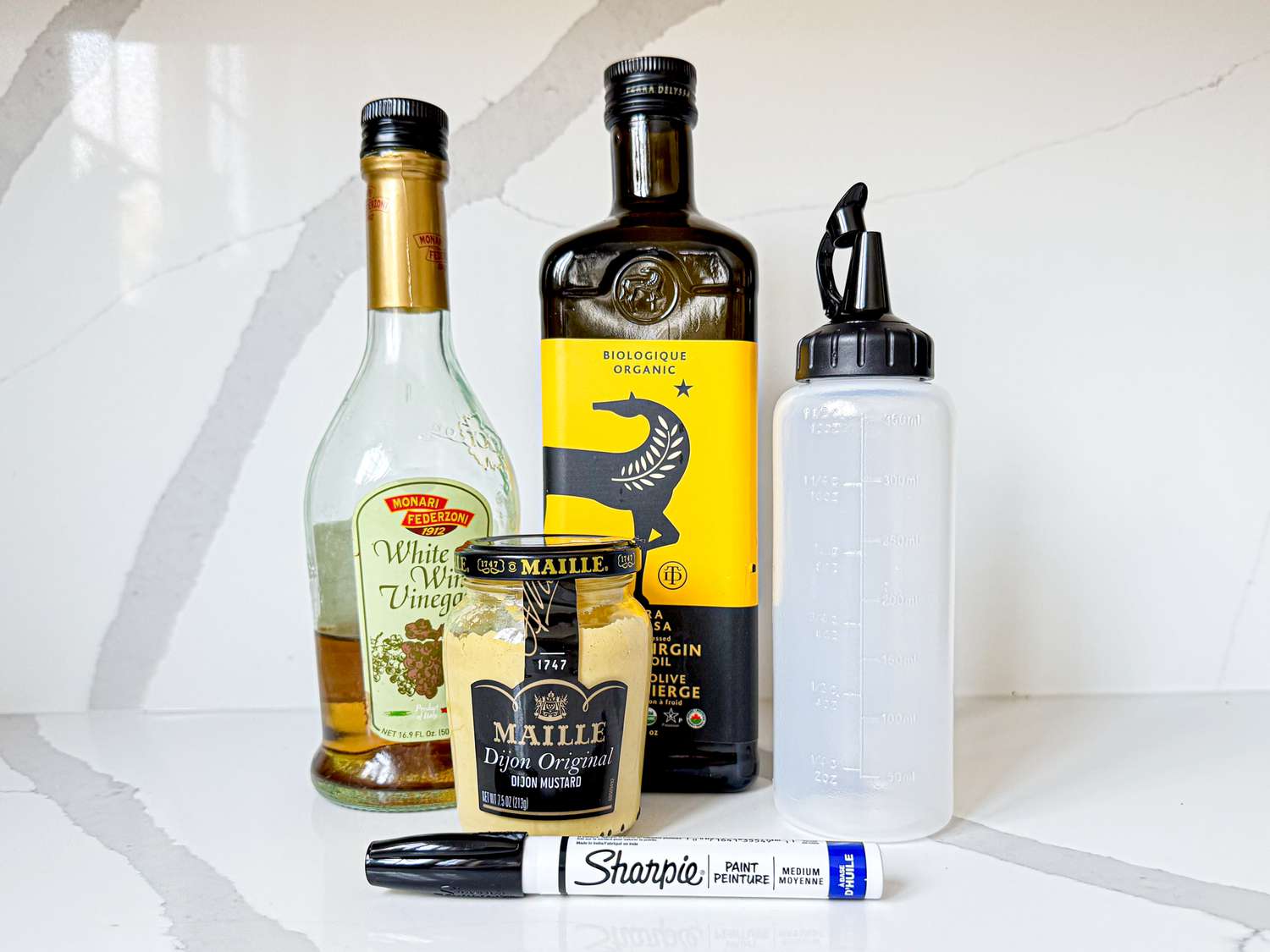 Side view of elements for sharpie squeeze bottle trick