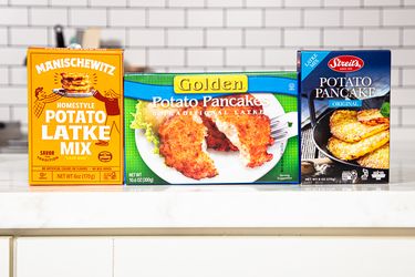 Three boxes of potato latke mix displayed on a countertop in a kitchen setting
