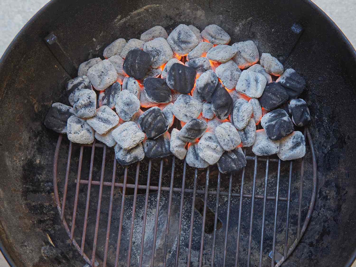 Hot coals heating up on a charcoal grill