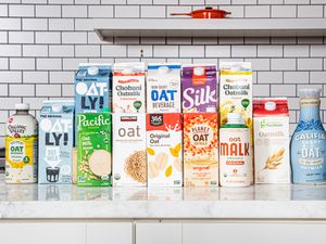 A selection of various oat milk brands displayed on a counter