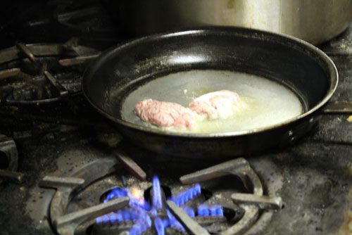 brains cooking on stovetop in saucepan