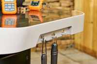 The hooks on the Weber Genesis E-325 Liquid Propane Gas Grill