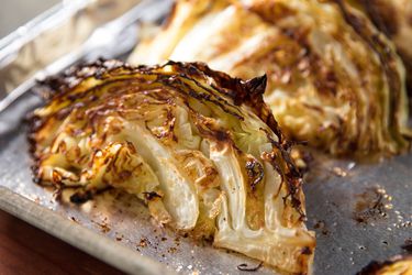 Side view of lightly charred roasted cabbage wedges