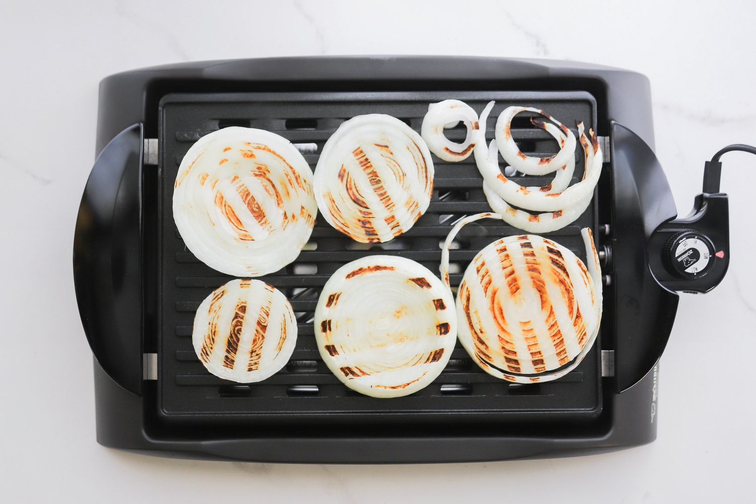 White onions grilling on the Zojirushi grill