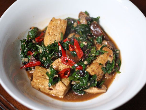 A bowl of Home-Style Tofu with Mushrooms, Spinach, and Fermented Black Beans