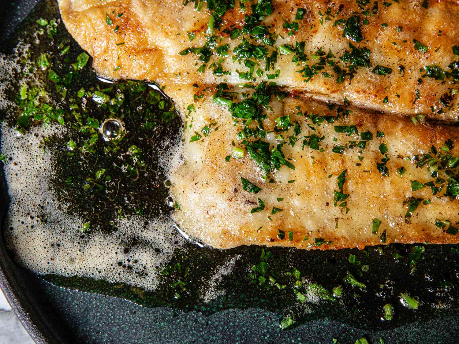 Close up crop of a plated sole meuniere.