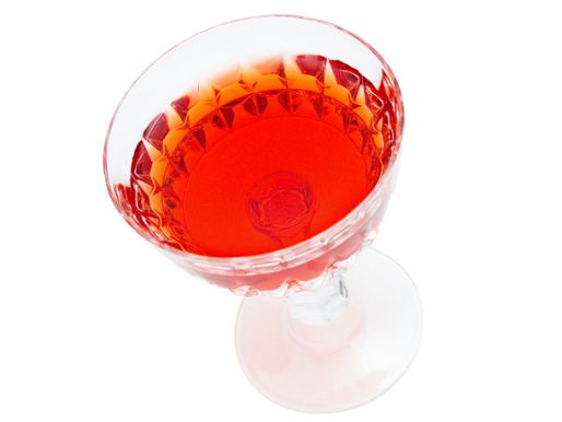 Eeyore's Requiem cocktail in a stylized coupe glass on a white backround.