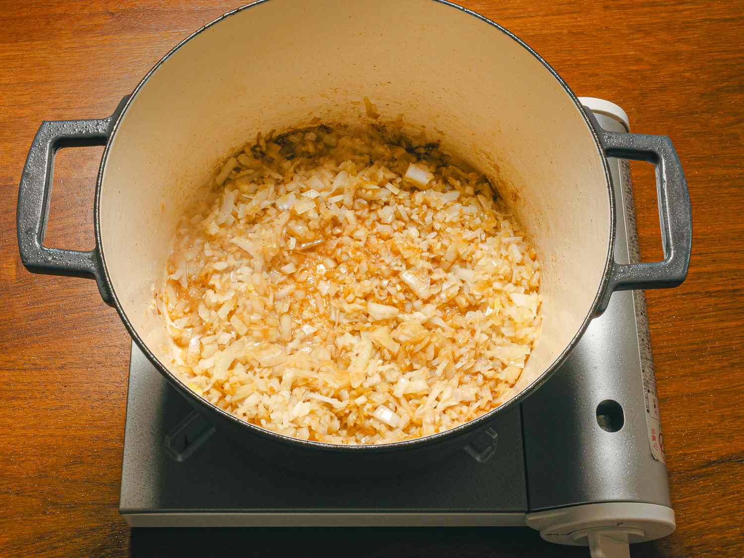Onions cooking in a pot on a stovetop