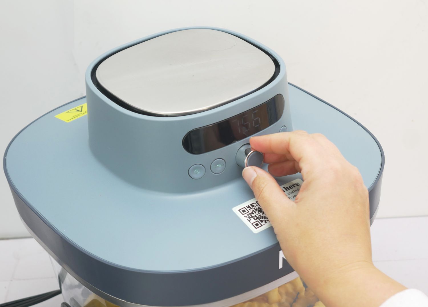 a closeup view of a person adjusting the ninja crispi