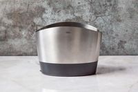 The stainless steel OXO utensil crock on a marble countertop.