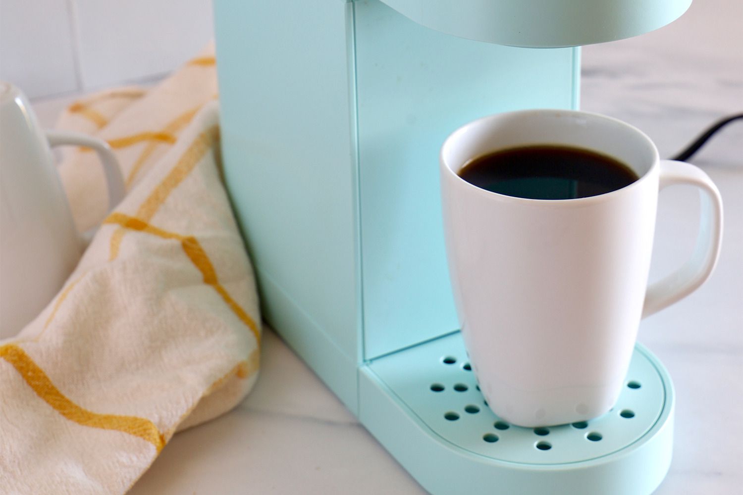 A cup of coffee made from a Keurig coffee maker.