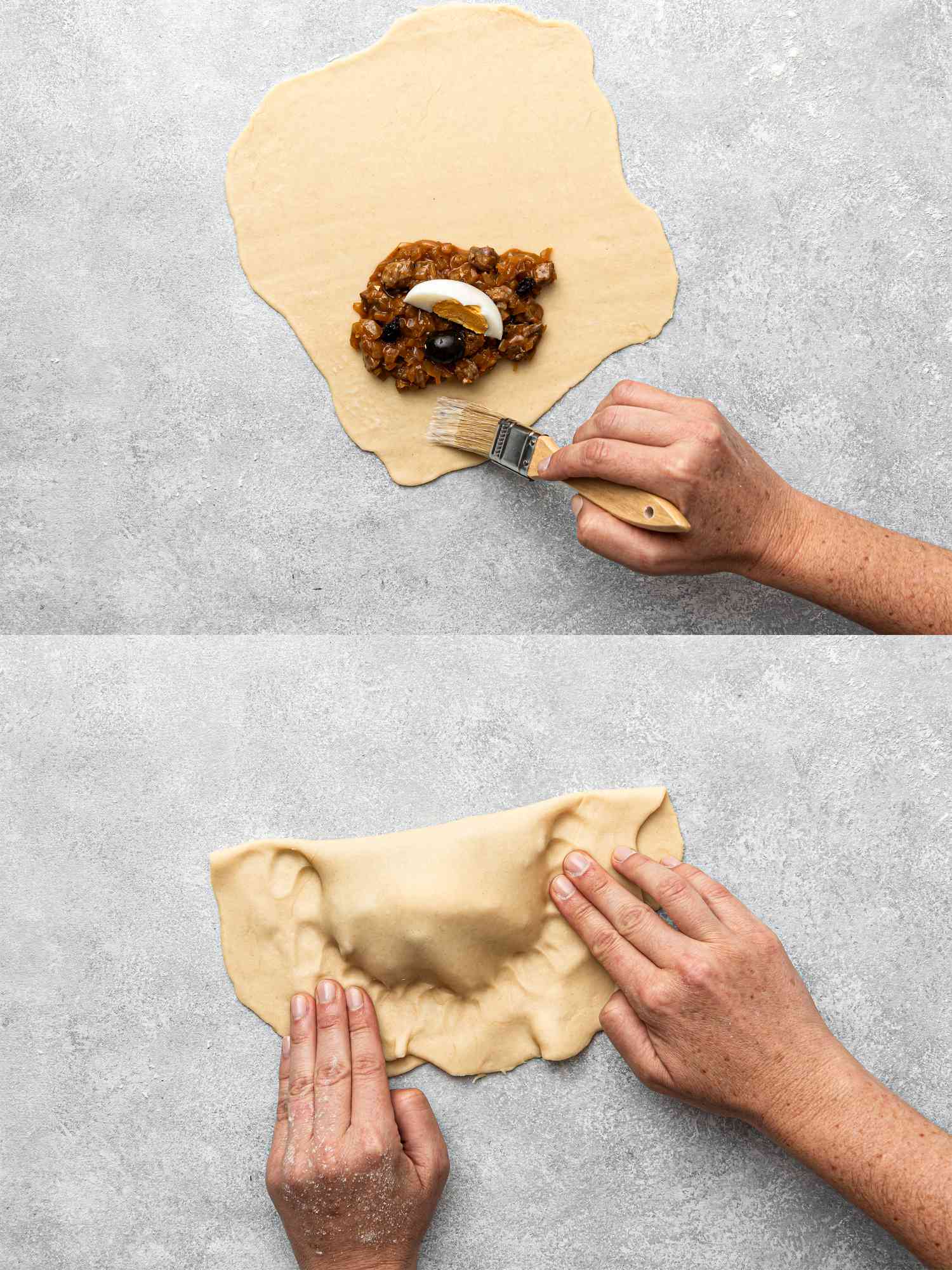 Filling and sealing a Chilean beef empanada, hands brushing edges with water and folding dough.