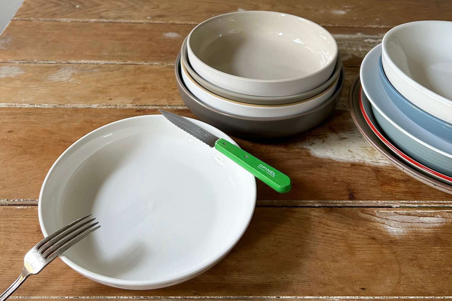 pasta bowls with a knife and fork near them