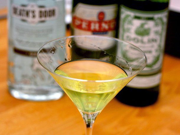 An Obituary Cocktail in a martini glass made with dry vermouth, gin, and absinthe.