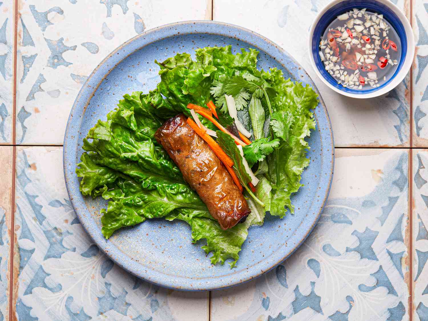 Overhead view of single imperial roll on lettuce