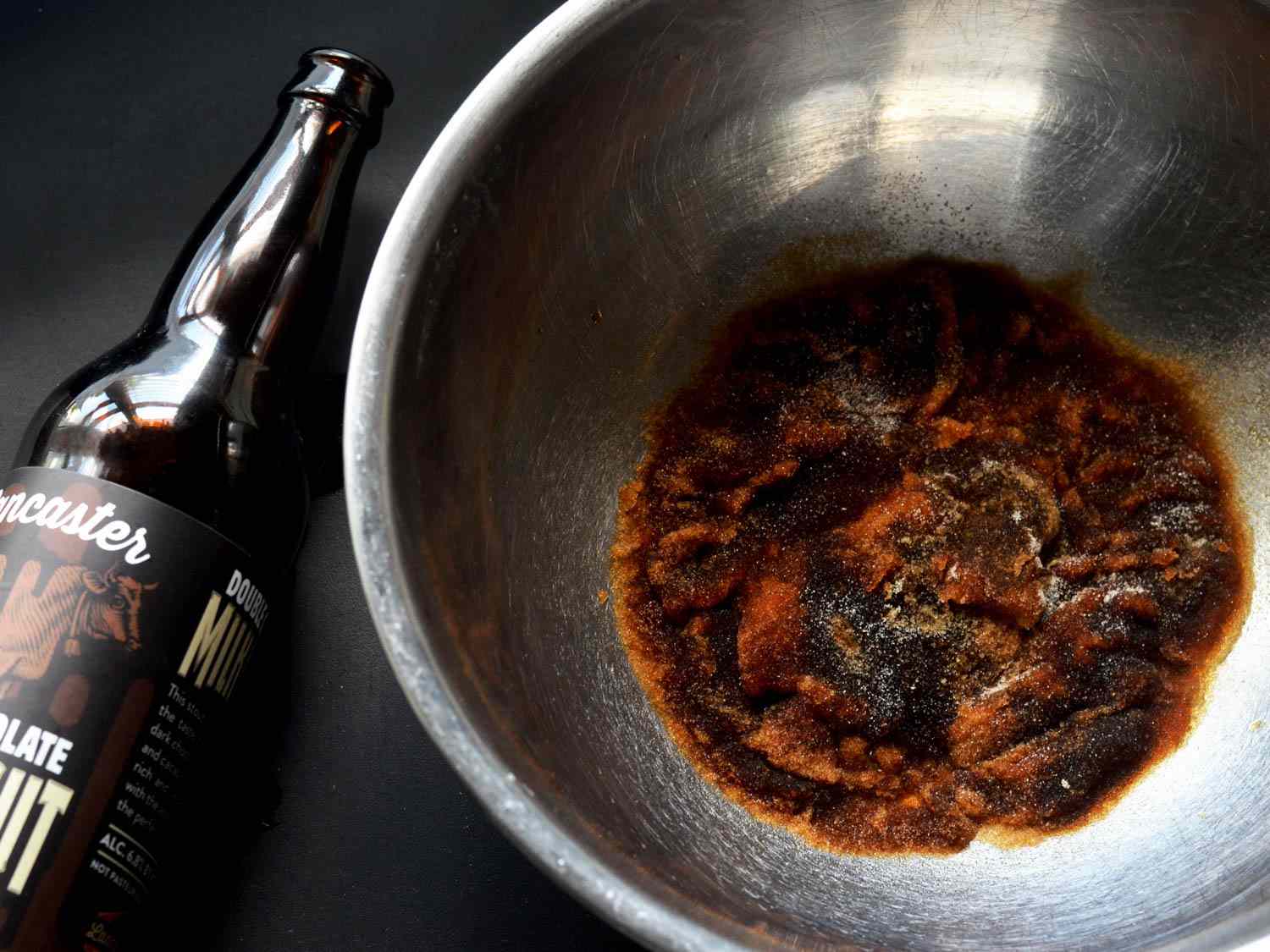 A chocolate stout has been poured into a mixing bowl and left to go flat.