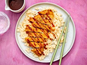 Overhead view of air fryer chicken katsu, served over rice.