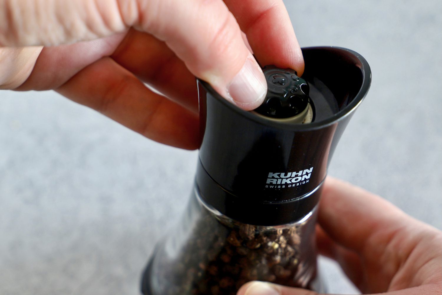 Person holding Kuhn Rikon Mini Pepper Grinder