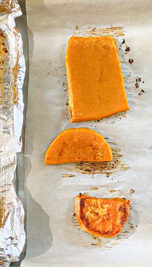 Baked vegetable slices on foillined trays arranged in sections