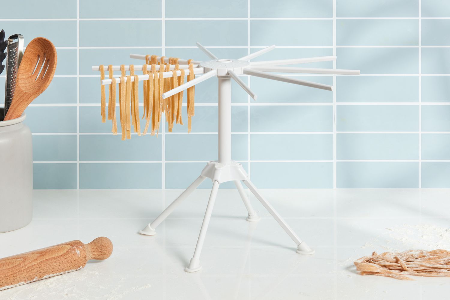 Pasta noodles hanging on the Ourokhome Collapsible Pasta Drying Rack