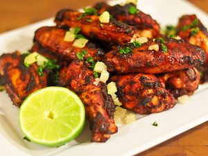 A platter of oven-fried chicken wings al pastor. 