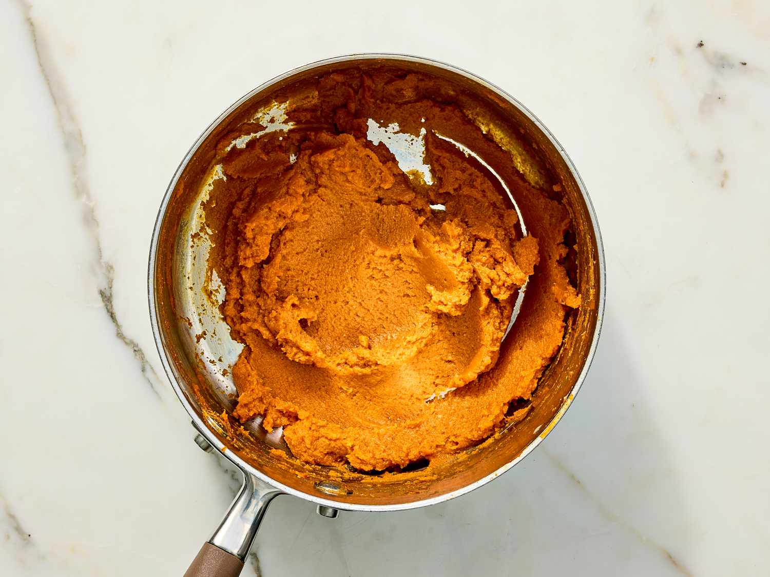 Pumpkin puree being cooked in a saucepan