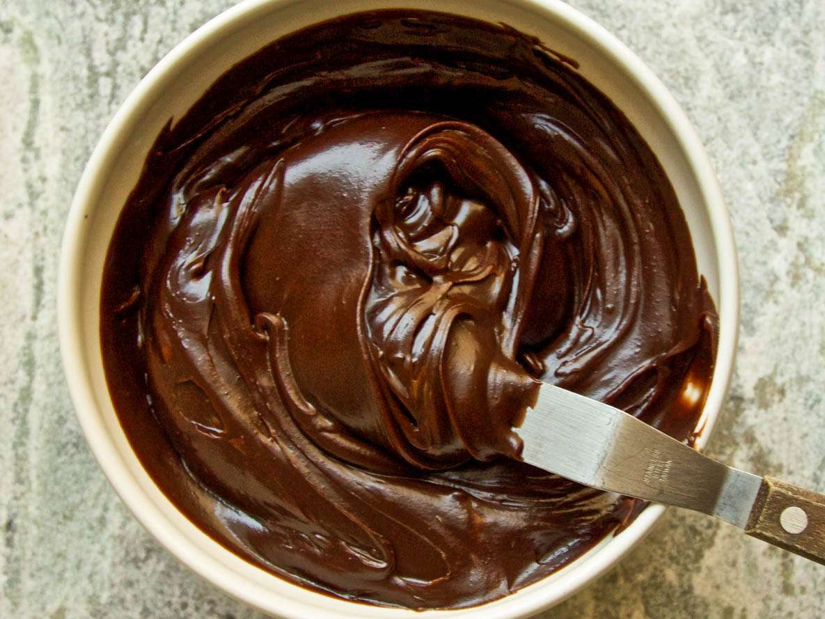 Stirring chocolate into caramel.