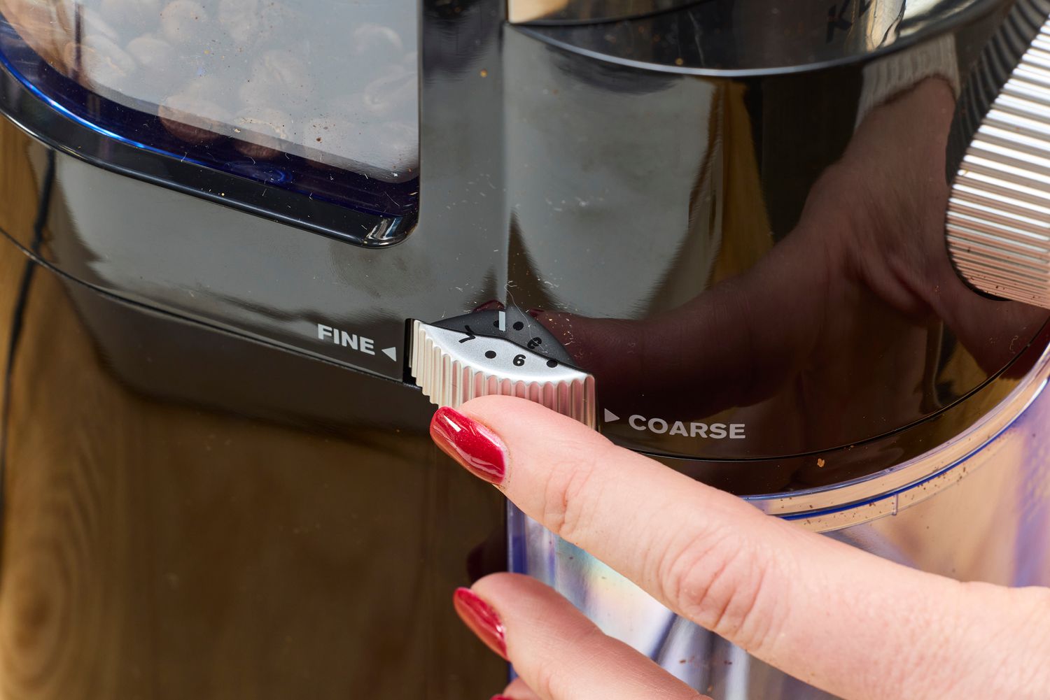 Person touching Krups Precision Coffee Grinder
