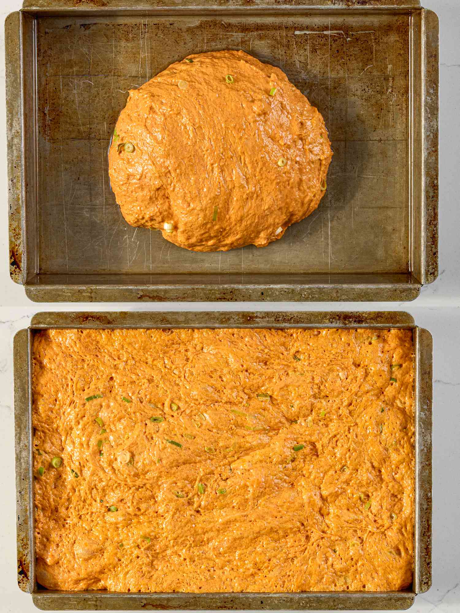 Two metal baking trays, one with a ball of orange-tinted dough and the other with the dough spread out flat
