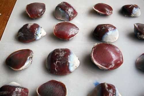 raw gizzards on a cutting board