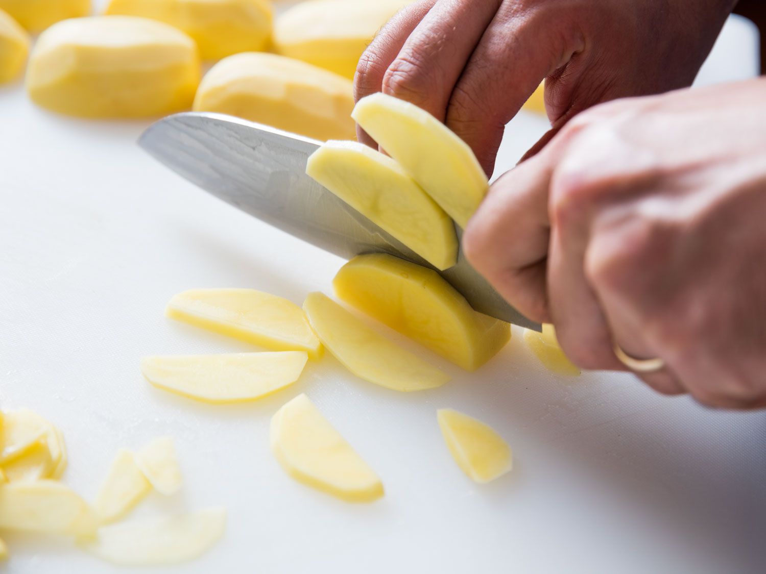 Slicing potatoes for Spanish tortilla.