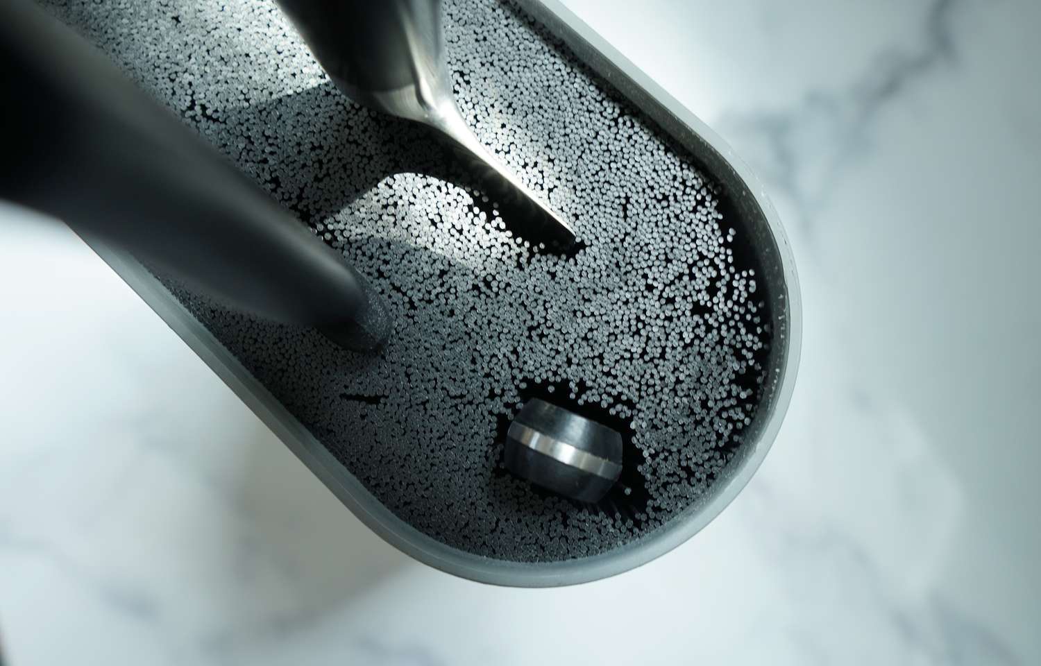 a closeup look at a knife block with lots of plastic needles holding knives