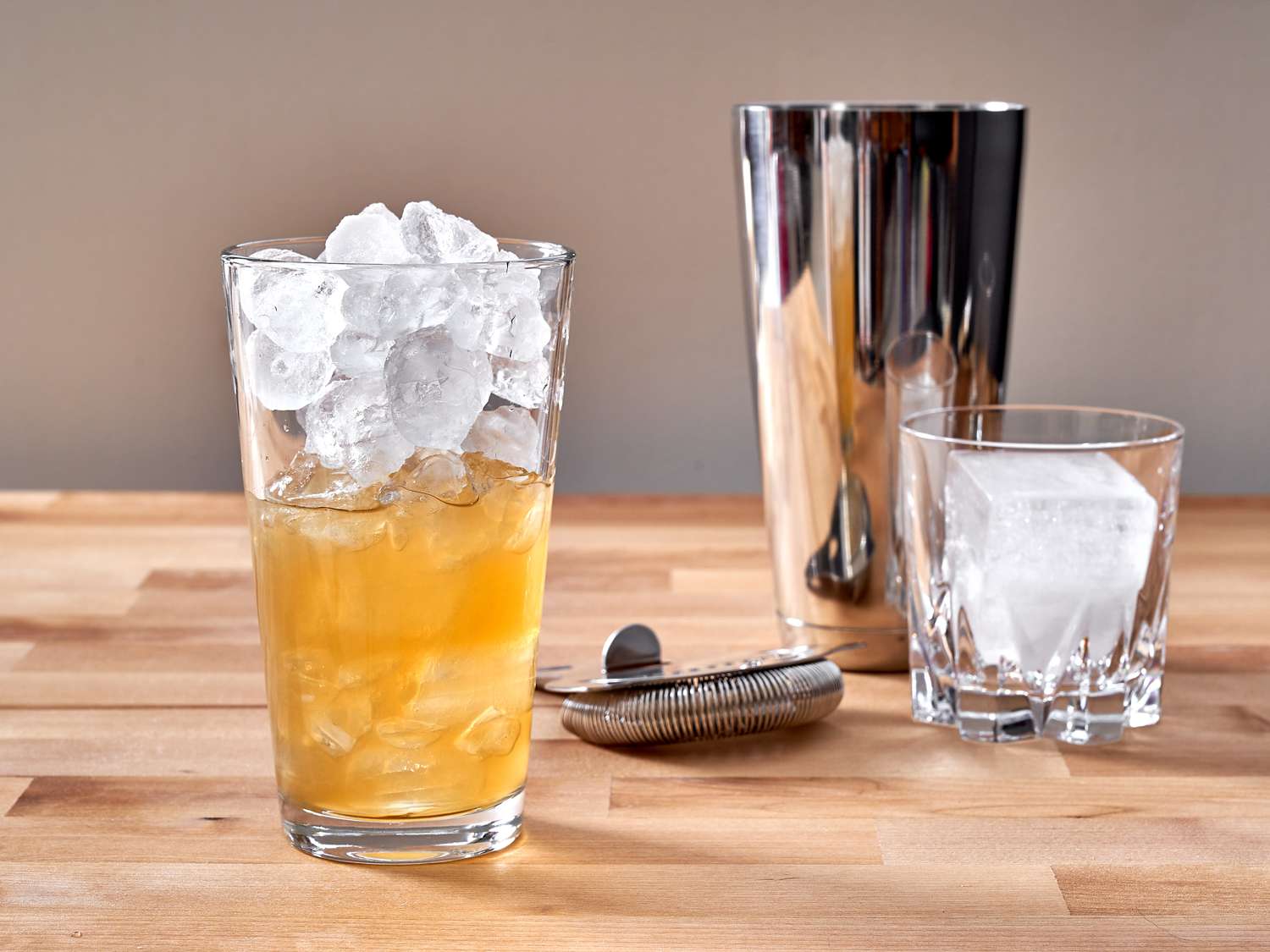 gold rush cocktail in a cocktail mixer