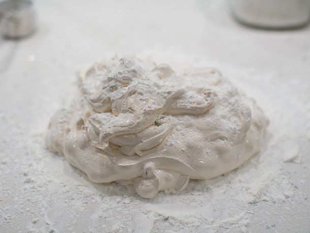 The pistachio-meringue mixture is turned out onto a cornstarch-dusted work surface.