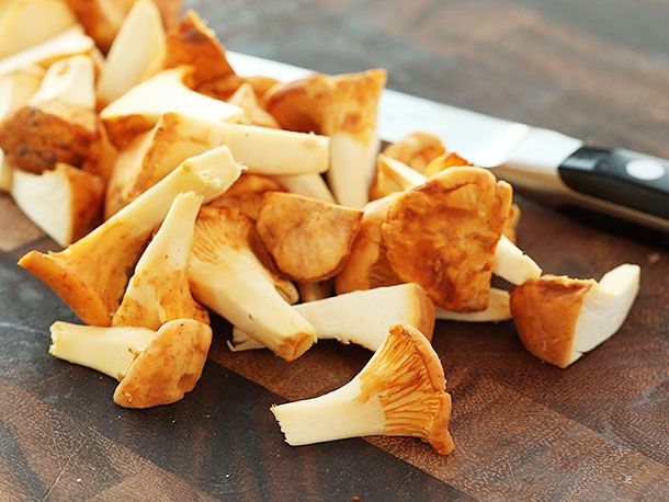 Trimmed and halved chanterelles, ready for cooking.