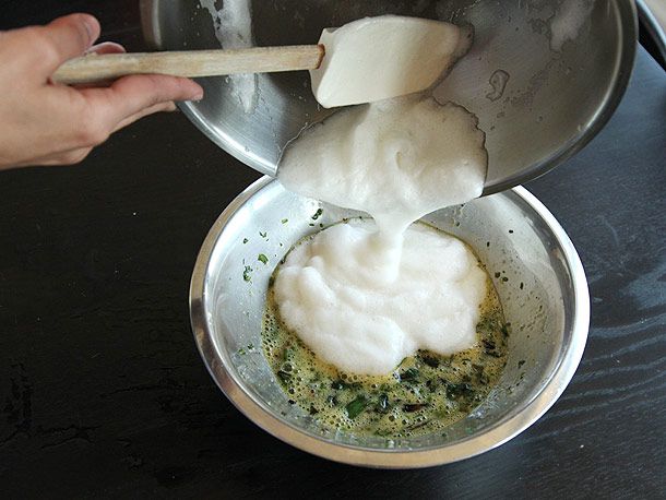 Whipped egg whites are added to the bowl.