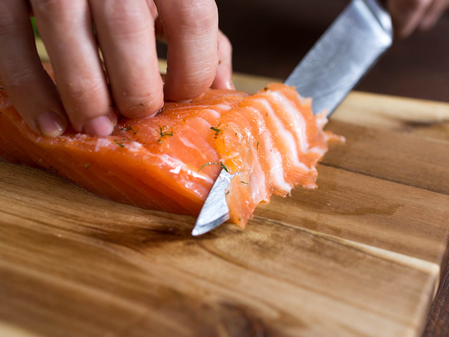Cutting gravlax.