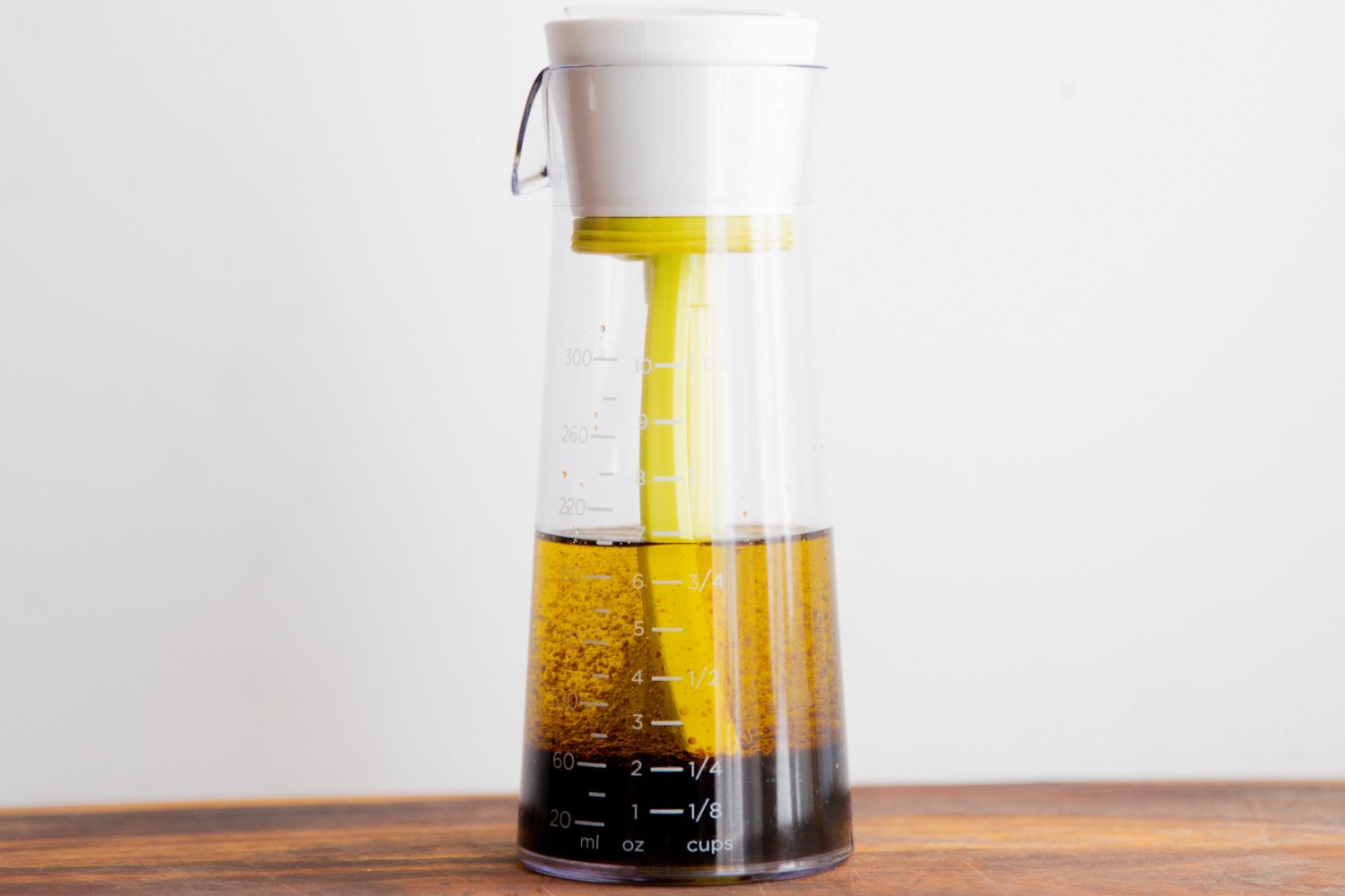 Emulstir Salad Dressing Mixer being filled with vinegar and oil
