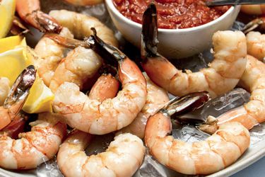 A plate of shrimp cocktail.