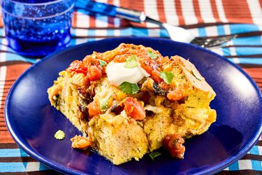 A serving of Southwest breakfast strata on a blue plate