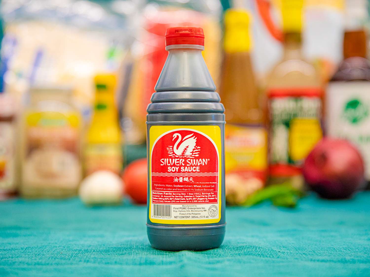 A bottle of Silver Swan Soy Sauce on a blue cloth