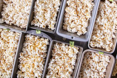 Several trays filled with popcorn, arranged in a grid pattern